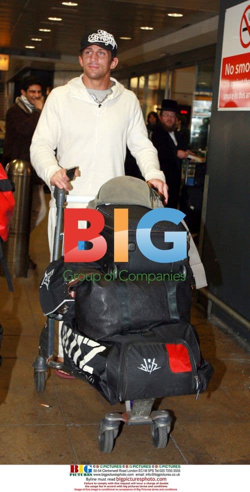 Alex Reid arrives in London from LA