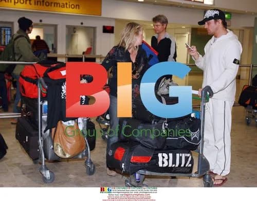 Alex Reid arrives in London from LA