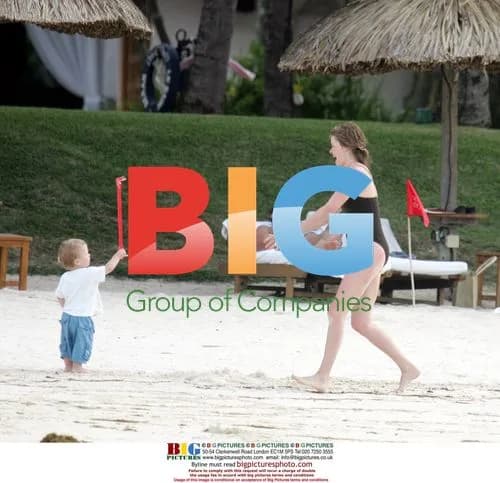 Dominic West on beach with family in Mauritius