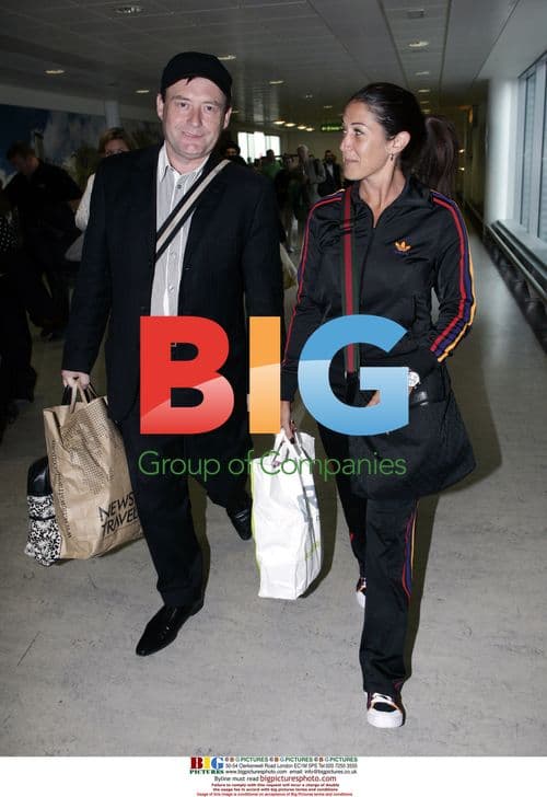 Jimmy White arrives home with girlfriend