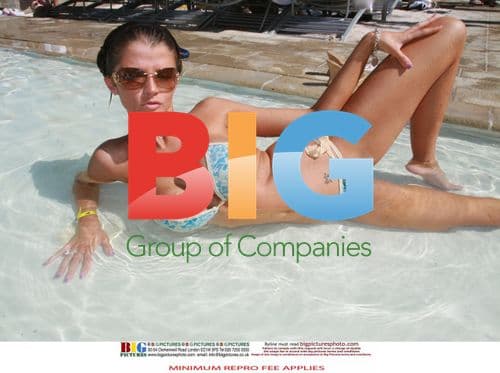 Joslyn James poses poolside