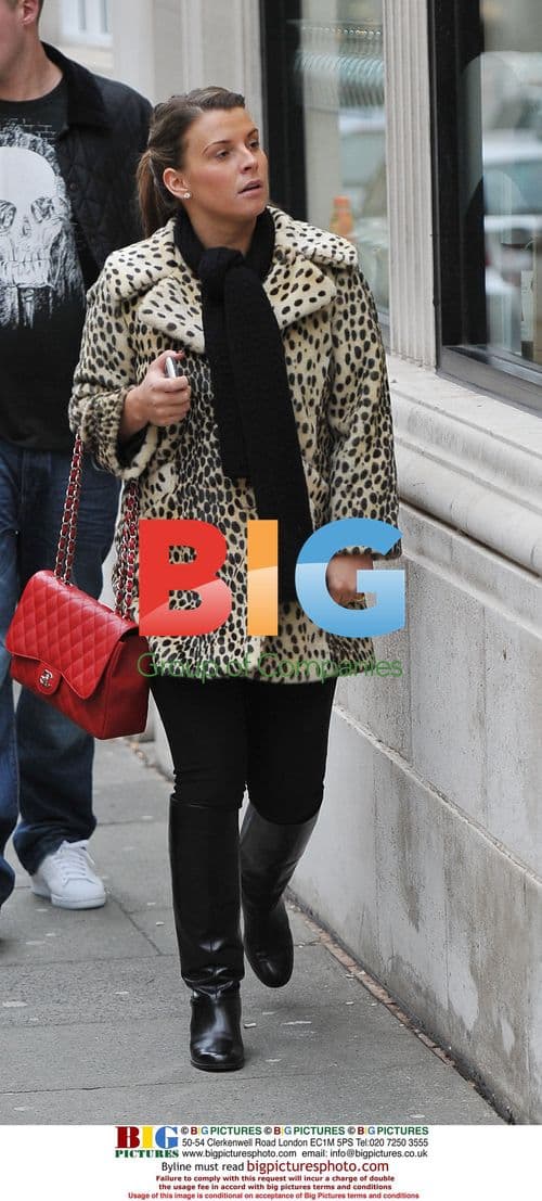 Coleen Rooney spotted in Liverpool with son Kai