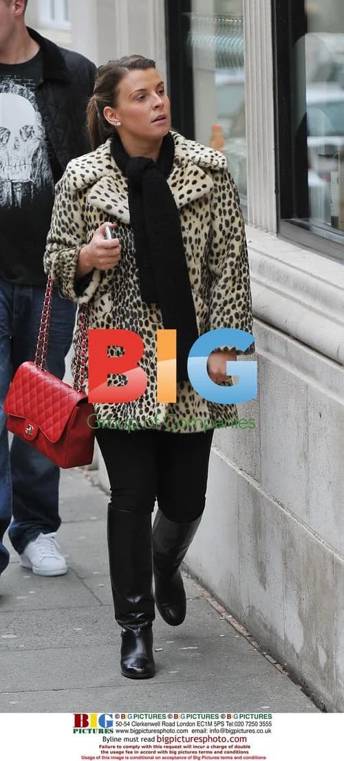 Coleen Rooney spotted in Liverpool with son Kai