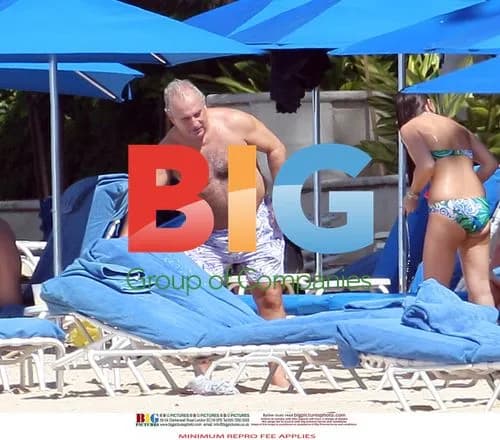 Sir Philip Green relaxes on Barbados beach