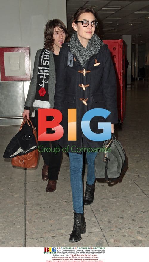 Alexa Chung and Alex Turner Arrive at Heathrow