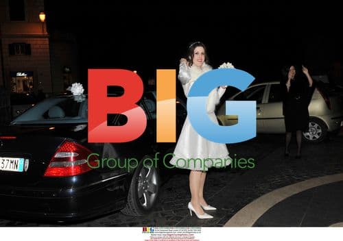 Proud bride Emma poses after wedding