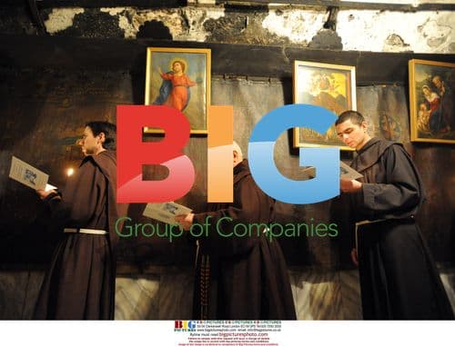 Franciscan brothers pray in Bethlehem grotto