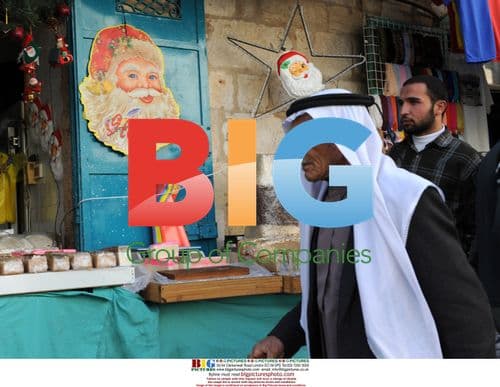 Palestinian in Bethlehem with Christmas Decor