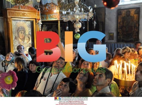 Christian pilgrims view icon in Church of Nativity