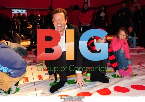 Piers Morgan plays Twister in Covent Garden