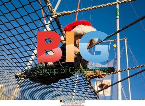 Verne Troyer in Santa hat after trapeze jump