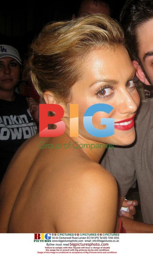 Brittany Murphy poses with fan in Los Angeles