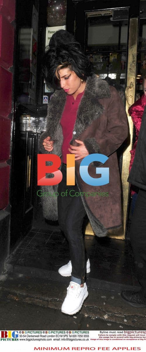 Amy Winehouse and friend leaving pub