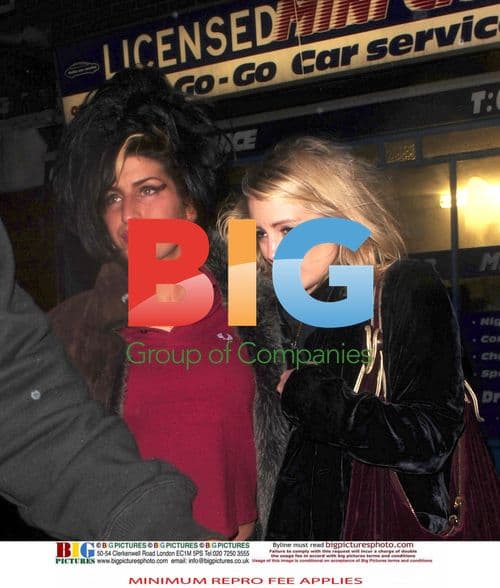 Amy Winehouse and friend leaving pub