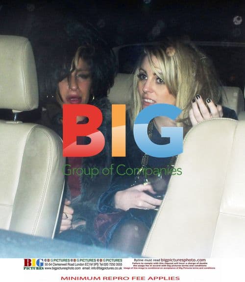 Amy Winehouse and Friend Leaving Pub