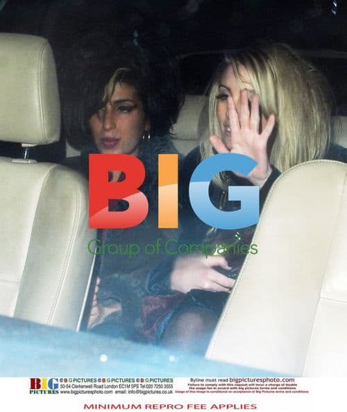 Amy Winehouse and friend leave pub in London