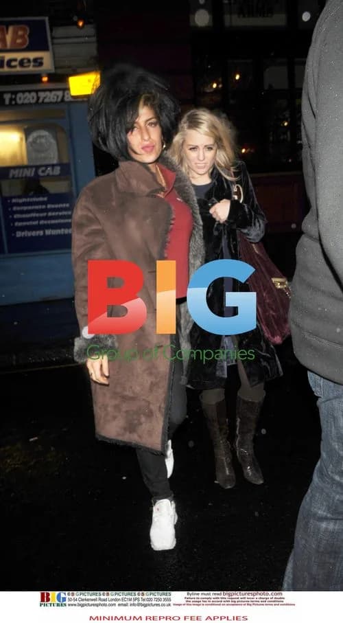 Amy Winehouse leaving pub with friend