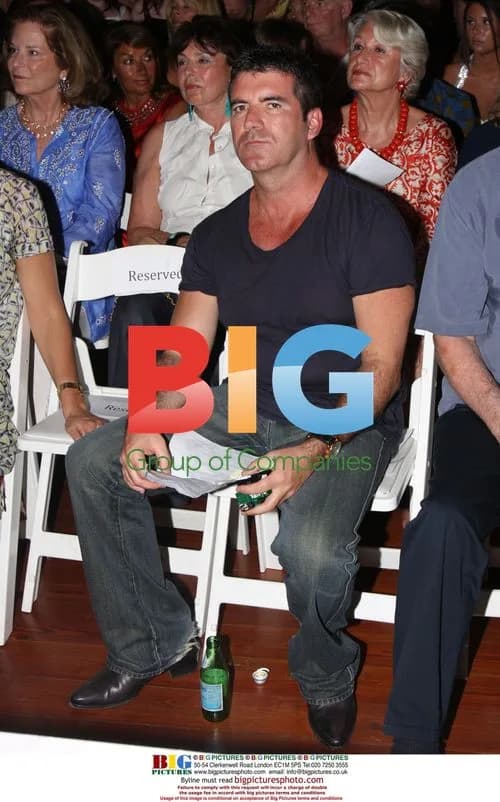 Simon Cowell with Furry Friend at Caribbean Auction