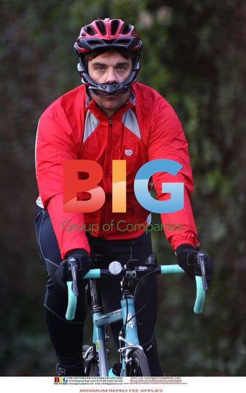 Robbie Williams Tests His New Bike