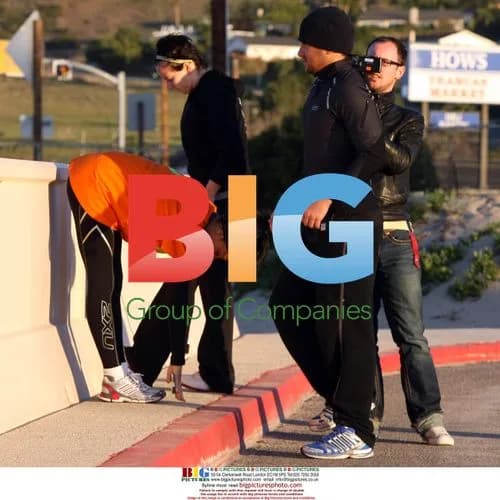 Katie Price and Peter Andre jogging on beach
