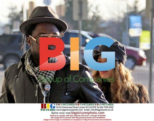 WILL.i.am Arrives at YVR with Mystery Girlfriend