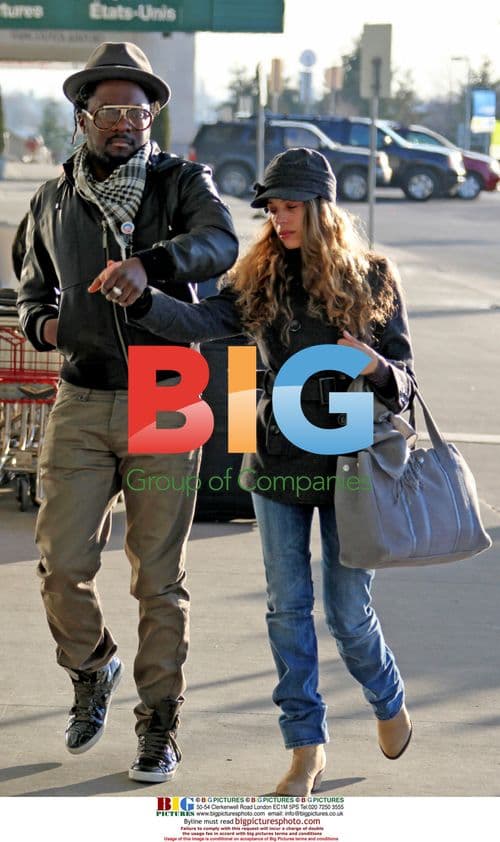 WILL.i.am arrives at YVR with Mystery Girlfriend