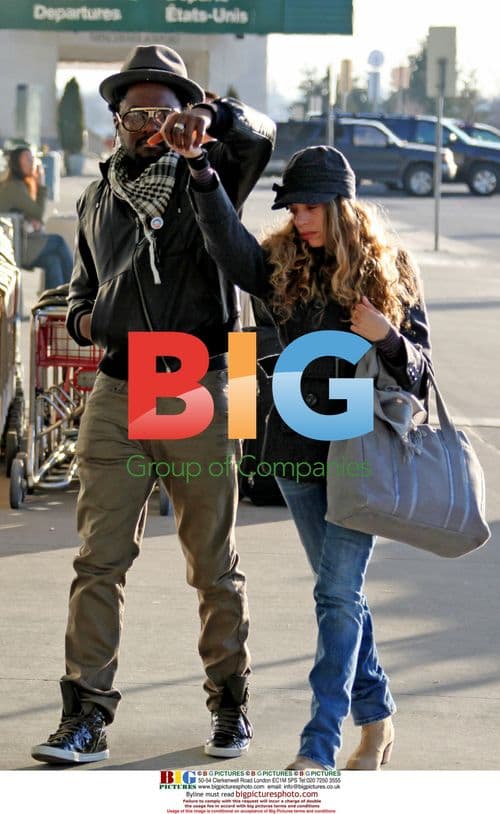 WILL.i.am Arrives at YVR with Mystery Girlfriend