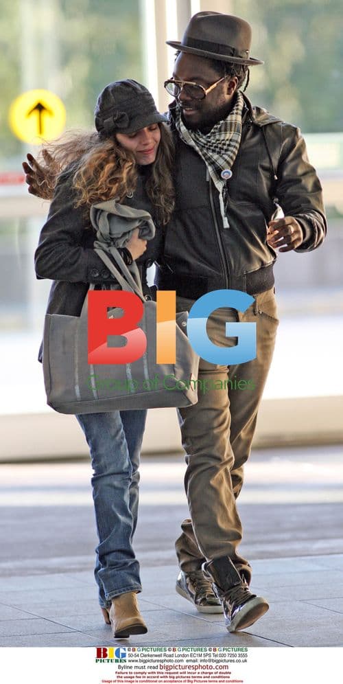 WILL.i.am Arrives at YVR with Mystery Girlfriend
