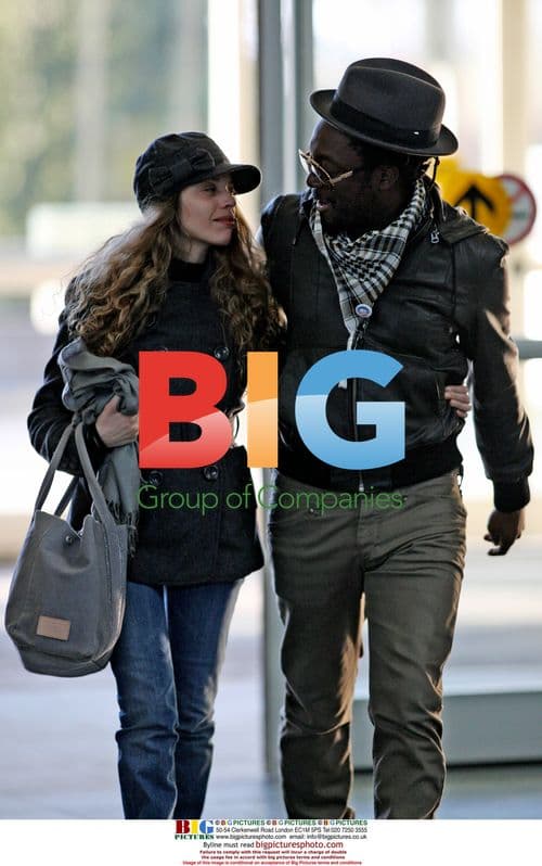 WILL.i.am arrives at YVR with Mystery Girlfriend