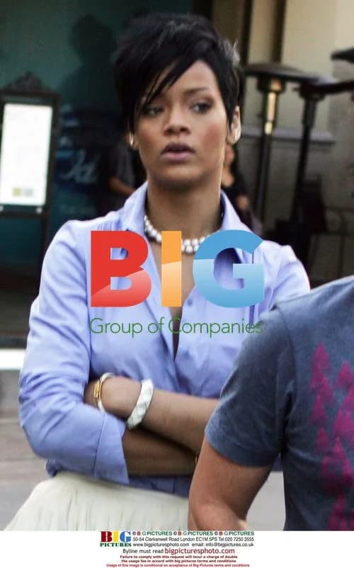 Rihanna leaves The Grove with assistant and bodyguard