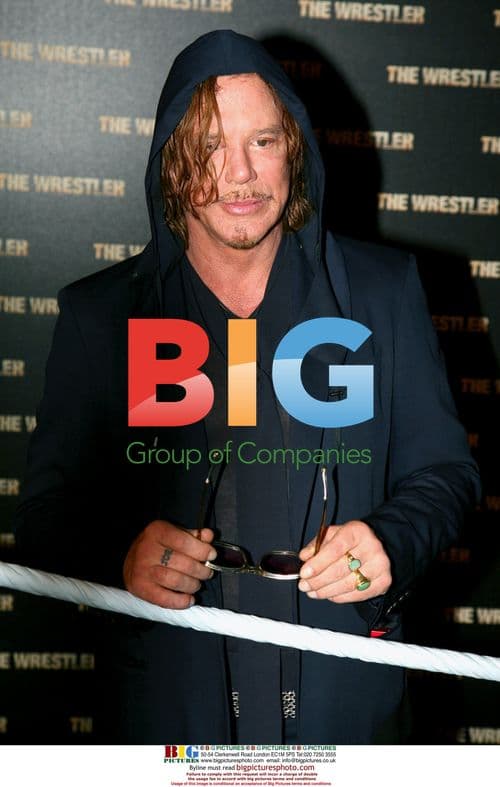 Mickey Rourke arrives with new girlfriend