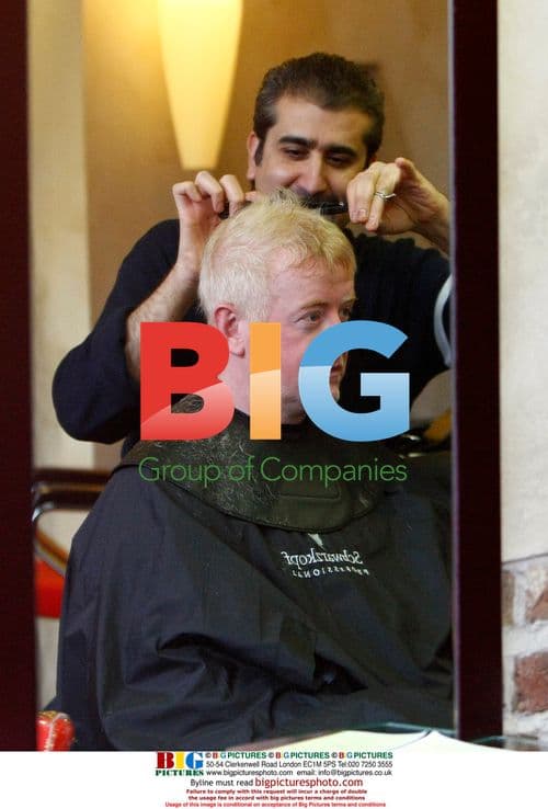 Chris Evans gets haircut in London