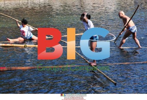People drift on bamboo rafts in Chinese park