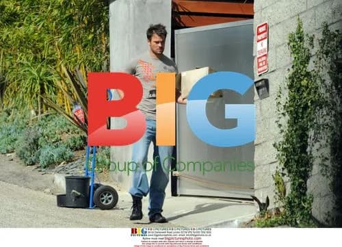 Josh Duhamel hauling planter outside home