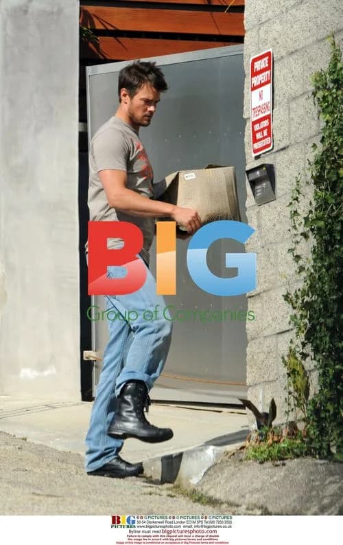Josh Duhamel hauls planter outside home