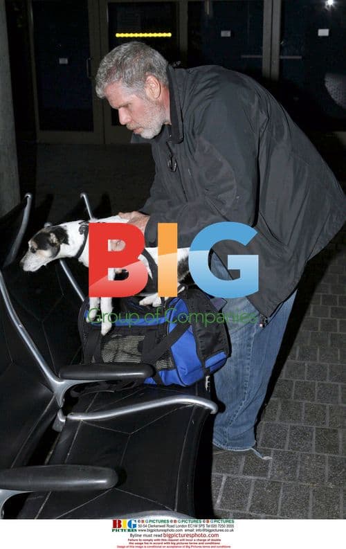 Ron Perlman Arrives at LAX with Dog