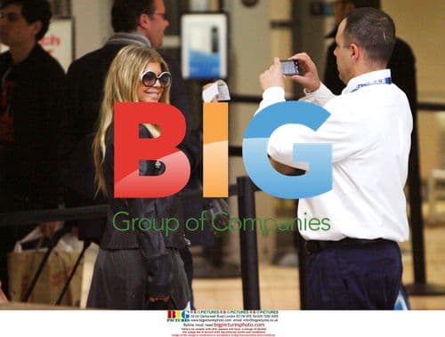 Fergie and Josh Duhamel Depart LAX