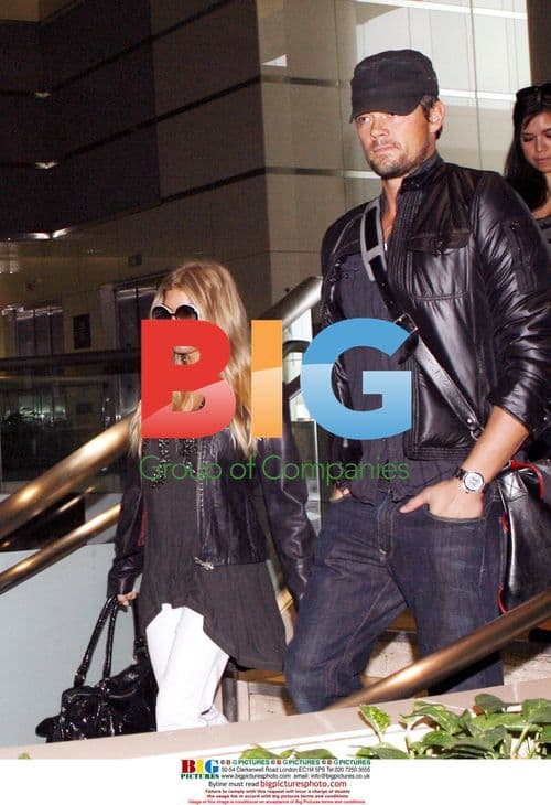 Newlyweds Fergie and Josh Duhamel depart LAX