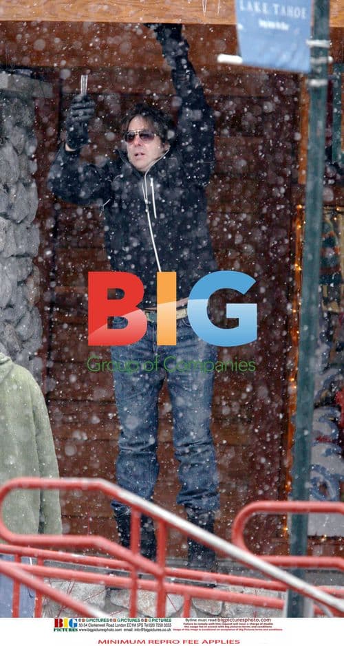 Jonathan Ross and family play in the snow