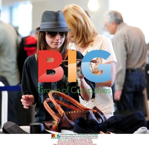 Ashley Tisdale at LAX with family
