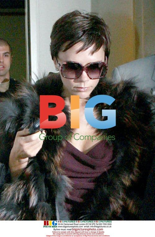 Victoria Beckham arrives at LAX in fur coat