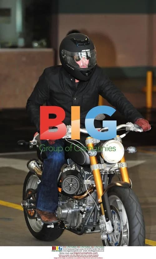 Brad Pitt leaves office on motorbike