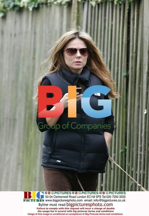 Geri Halliwell walking dog, texting in London