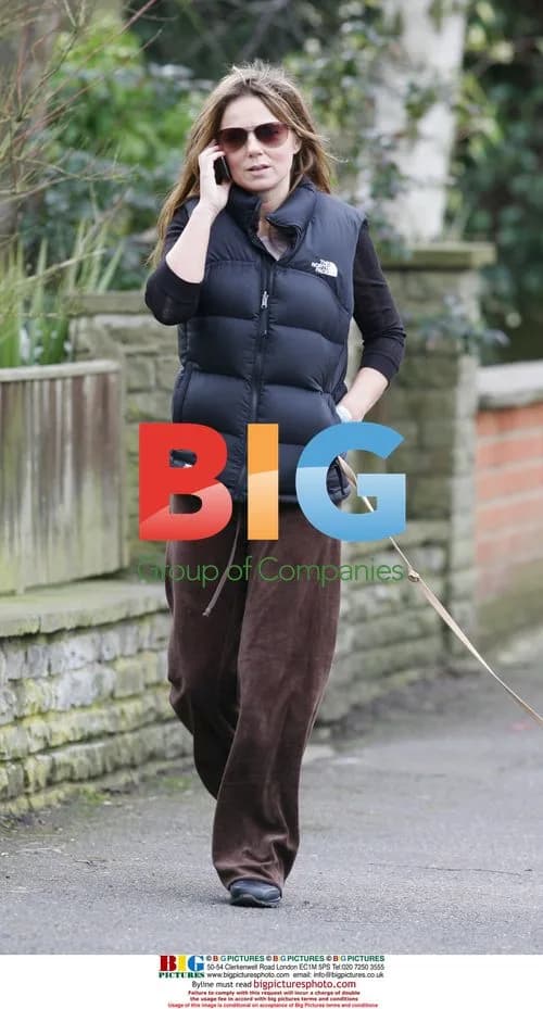 Geri Halliwell walking dog, chatting on phone