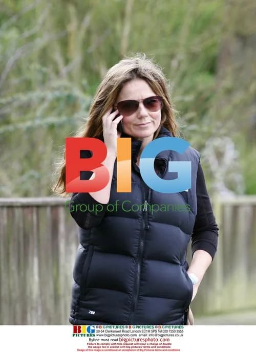 Geri Halliwell walks dog, talks on phone in London