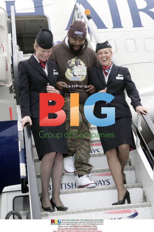 Mr. T Escorted by Stewardesses at London Heathrow