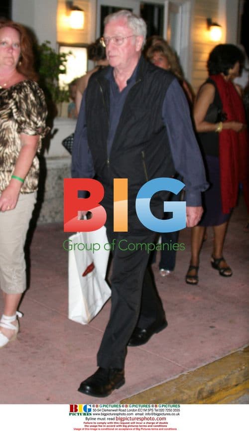 Michael Caine with wife and daughter dining in Miami