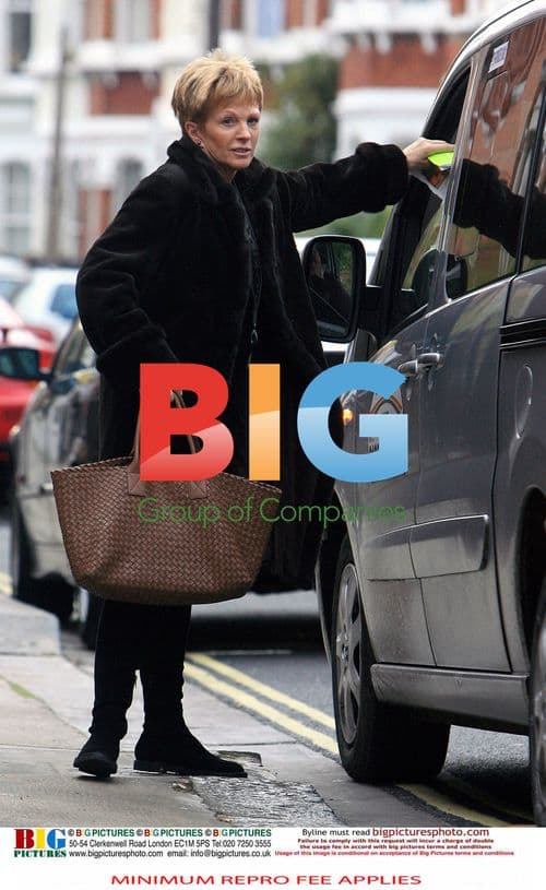 Anne Robinson out with dog and shopping