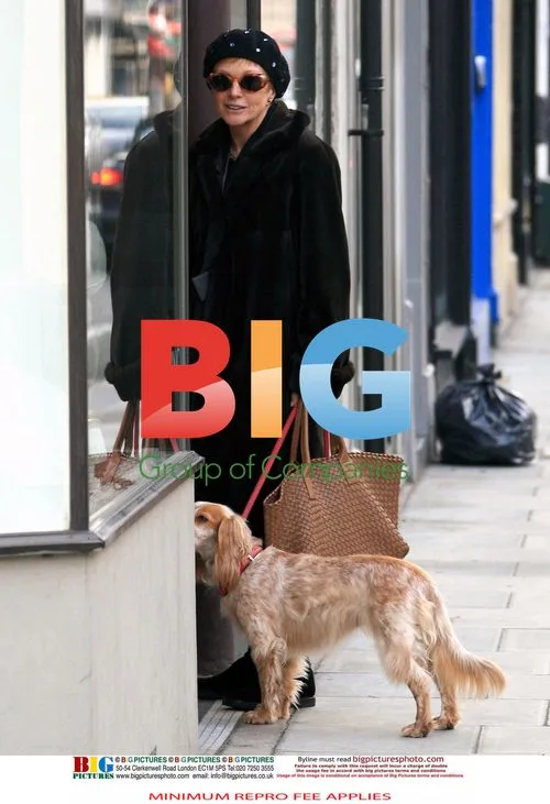 Anne Robinson out with dog and shopping