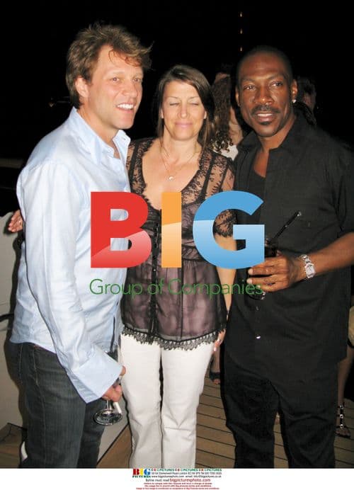 Eddie Murphy with girlfriend at Paul Allen's party